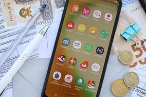 TERNOPIL, UKRAINE - AUGUST 3, 2023 Banking applications on screen of display on smartphone. Official apps of famous polish banks photo