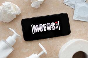 KYIV, UKRAINE - JANUARY 23, 2024 MofosCom adult content website logo on display of iPhone 12 Pro photo