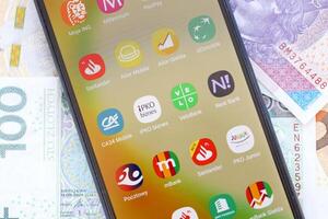 TERNOPIL, UKRAINE - AUGUST 3, 2023 Banking applications on screen of display on smartphone. Official apps of famous polish banks photo