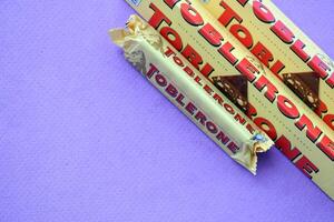 KYIV, UKRAINE - OCTOBER 31, 2023 Yellow Toblerone Chocolate Bar. Toblerone originated in Switzerland around 1908 photo