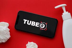 KYIV, UKRAINE - JANUARY 23, 2024 Tube8 adult content website logo on display of iPhone 12 Pro photo