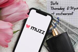 KYIV, UKRAINE - FEBRUARY 23, 2024 Muzz logo of famous dating website or app on iPhone display photo