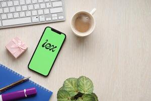 KYIV, UKRAINE - FEBRUARY 23, 2024 Lex logo of famous dating website or app on iPhone display photo