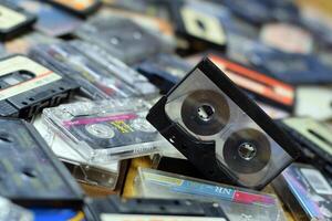 KYIV, UKRAINE - 4 MAY, 2023 Pile of audio cassettes lying on top of each other. Retro audio storage photo