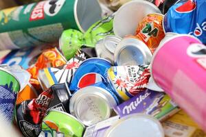 KYIV, UKRAINE - 4 MAY, 2023 Big pile of various wrappings and empty disposable packages and cups from famous branded food photo