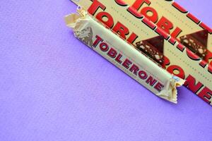 KYIV, UKRAINE - OCTOBER 31, 2023 Yellow Toblerone Chocolate Bar. Toblerone originated in Switzerland around 1908 photo