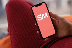 KYIV, UKRAINE - FEBRUARY 23, 2024 Senior Match logo of famous dating website or app on iPhone display photo