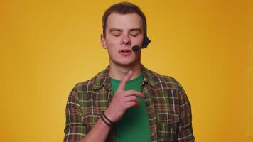 Young man freelance worker call center or support service operator helpline having talk with client video