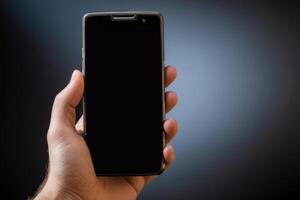 Close-up of a person's hand holding a smartphone photo