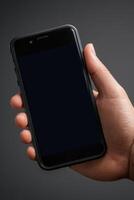 Close-up of a person's hand holding a smartphone photo