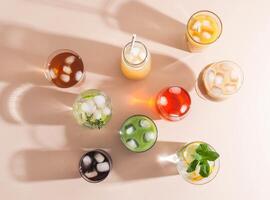 Various refreshing non-alcoholic drinks in glasses with ice photo