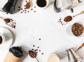 Flat lay frame of coffee, various utensils for making coffee and cups of coffee photo