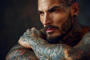 A close-up portrait of a man with a beard and tattoos on his face and body photo