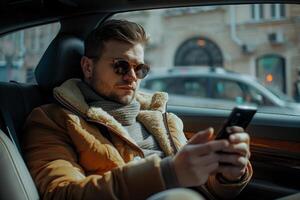 Man using smartphone while sitting in car in city photo