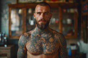 Bearded man with chest and arm tattoos posing in front of a wooden cabinet photo