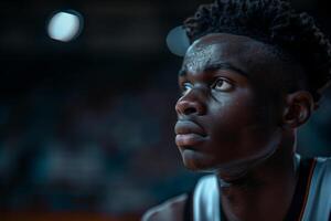 Focused young basketball player on the court during a game photo