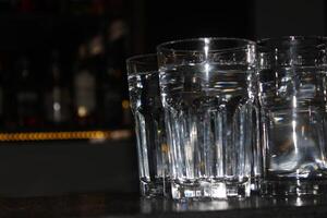 Empty glasses on the counter in bar, club. photo
