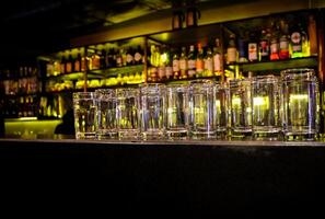 Empty glasses on the counter in bar, club. photo