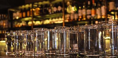 Drink glasses on the counter in bar, club. photo