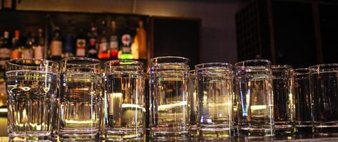 glass of alcohol drinks on table in bar. photo
