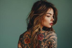 Woman with colorful back tattoo looking over shoulder photo