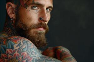Portrait of a bearded man with extensive tattoos photo