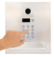 Person Using Security Access Control Keypad, Intercom. photo