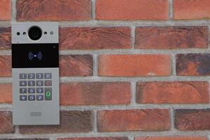 Doorbell Intercom on Brick Wall photo