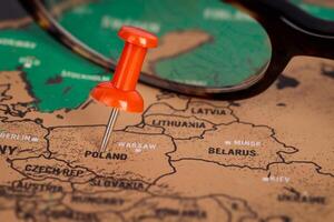 Red Pin Marking Poland on Map photo