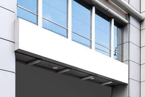 Mock up white horizontal LED display billboard on entrance office building. Clipping path for mockup photo