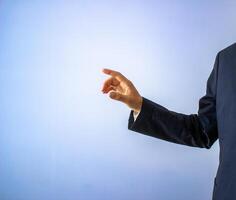 professional man pointing at something, copy space background, business marketing concept photo