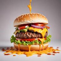 Delicious burger with many ingredients isolated on white background Tasty cheeseburger splash sauce photo