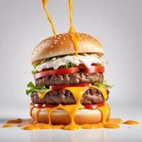 Delicious burger with many ingredients isolated on white background Tasty cheeseburger splash sauce photo