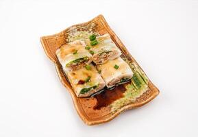 Beef sausage topping with sesame seeds and spring onion served in tray isolated on grey background side view of chinese food photo