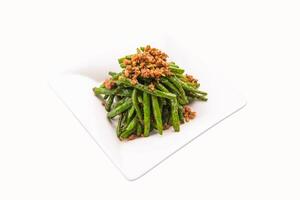 Sauteed String Beans with garlic paste served in plate isolated on grey background side view of hong kong food photo