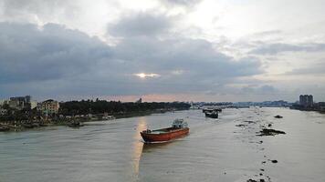Beautiful scenery of colorful clouds reflecting in the river during sunset photo