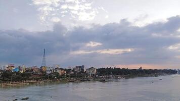 Beautiful scenery of colorful clouds reflecting in the river during sunset photo