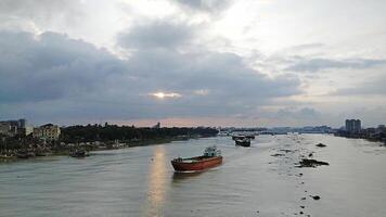 Beautiful scenery of colorful clouds reflecting in the river during sunset photo