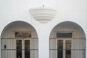 Building with beautiful windows and steel grilles photo