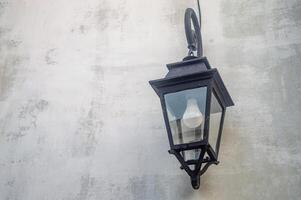 Medieval wall with a lamp in Surabaya old city area with white wall copy space photo