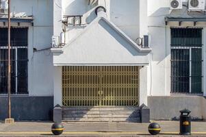 an old closed office building in Dutch colonial style photo