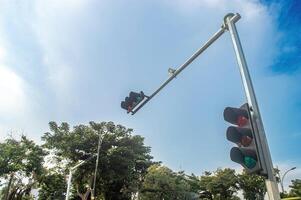 a semaphore traffic light to help pedestrians cross urban highways photo