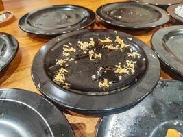 many leftover plates of sushi food in Japanese restaurants. hygiene and health content. photo