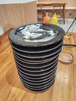 pile of plates of leftover sushi food in a Japanese restaurant with an all you can eat or buffet concept and Kaitenzushi or moving conveyor sushi. photo