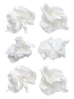 Top view set of screwed or crumpled tissue paper balls after use isolated on white background with clipping path photo