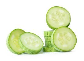 Front view of green cucumber slices or pieces in stack isolated on white background with clipping path photo
