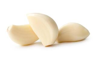 Front view of peeled garlic cloves in stack isolated on white background with clipping path photo
