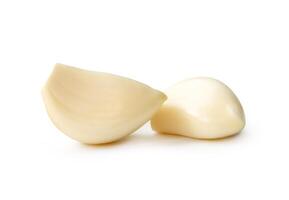 Front view of white peeled garlic cloves isolated on white background with clipping path photo
