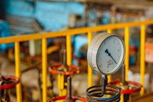 Gas manometer on background Valves manual in production process. Production process used manual valve to control the system. photo