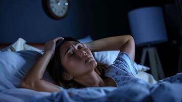 Woman Struggling With Insomnia at Night in Bed, Stressful Sleeplessness, Anxiety Concept, Dimly Lit Bedroom photo